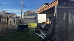 Fenced backyard featuring a patio