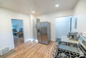 Kitchen featuring stainless steel appliances, light wood-type flooring, and recessed lighting