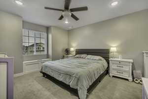 Bedroom with carpet floors, a ceiling fan, and recessed lighting