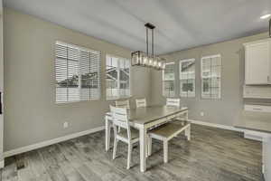 Dining area with light wood-style flooring
