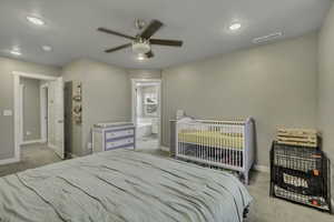Bedroom featuring light colored carpet, ceiling fan, and recessed lighting