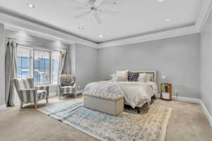 Carpeted bedroom featuring a ceiling fan and recessed lighting
