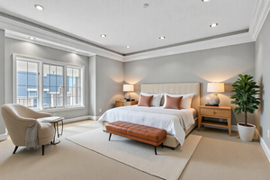 Master bedroom with natural light and view of the mountain.