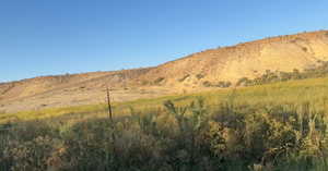 View of mountain background featuring rural landscape
