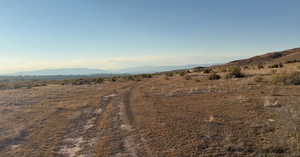 View of mountain backdrop with rural landscape