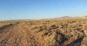 View of mountain background featuring rural landscape
