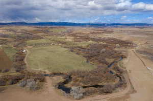 Aerial view of sparsely populated area with a mountainous background