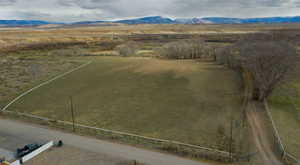 Overview of rural landscape featuring a mountainous background