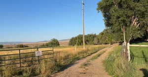 View of dirt / gravel road with a view of countryside