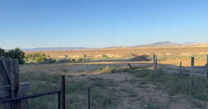 View of yard featuring a view of countryside and a mountain view