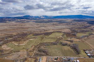 Aerial overview of property's location featuring mountains and rural landscape