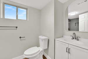 Bathroom featuring vanity and a shower