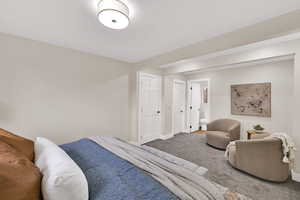 Bedroom with carpet flooring and baseboards