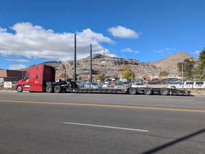 View of asphalt street featuring a mountain view