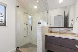 Full bath featuring vanity and a stall shower