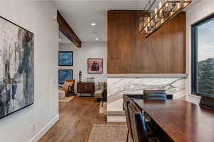 Dining space with dark wood-style flooring and recessed lighting