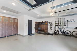 Garage with baseboards and recessed lighting