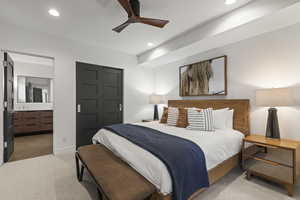 Bedroom with light carpet, ensuite bath, a closet, a ceiling fan, and recessed lighting
