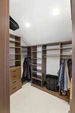 Spacious closet with lofted ceiling