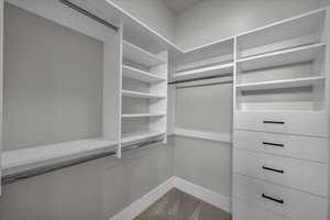 Spacious closet with carpet floors
