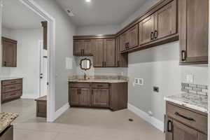 Laundry room with washer hookup, gas dryer hookup, electric dryer hookup, cabinet space, and light tile patterned floors