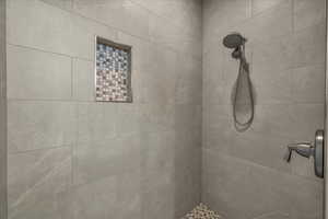 Full bath with tiled shower