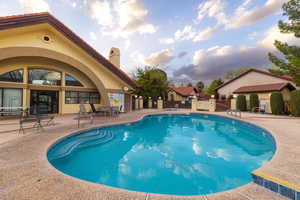 Community pool featuring a patio area