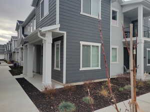 View of property exterior featuring a central AC unit