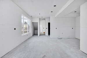 Spare room featuring concrete flooring