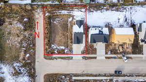 Snowy aerial view with property boundaries highlighted