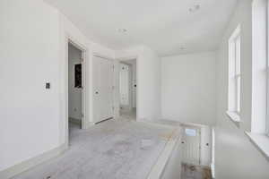 Spare room featuring baseboards