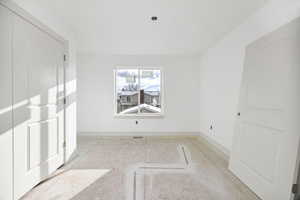 Spare room featuring baseboards