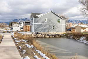 Snow covered property with a mountain view