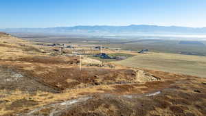 View of mountain backdrop with rural landscape