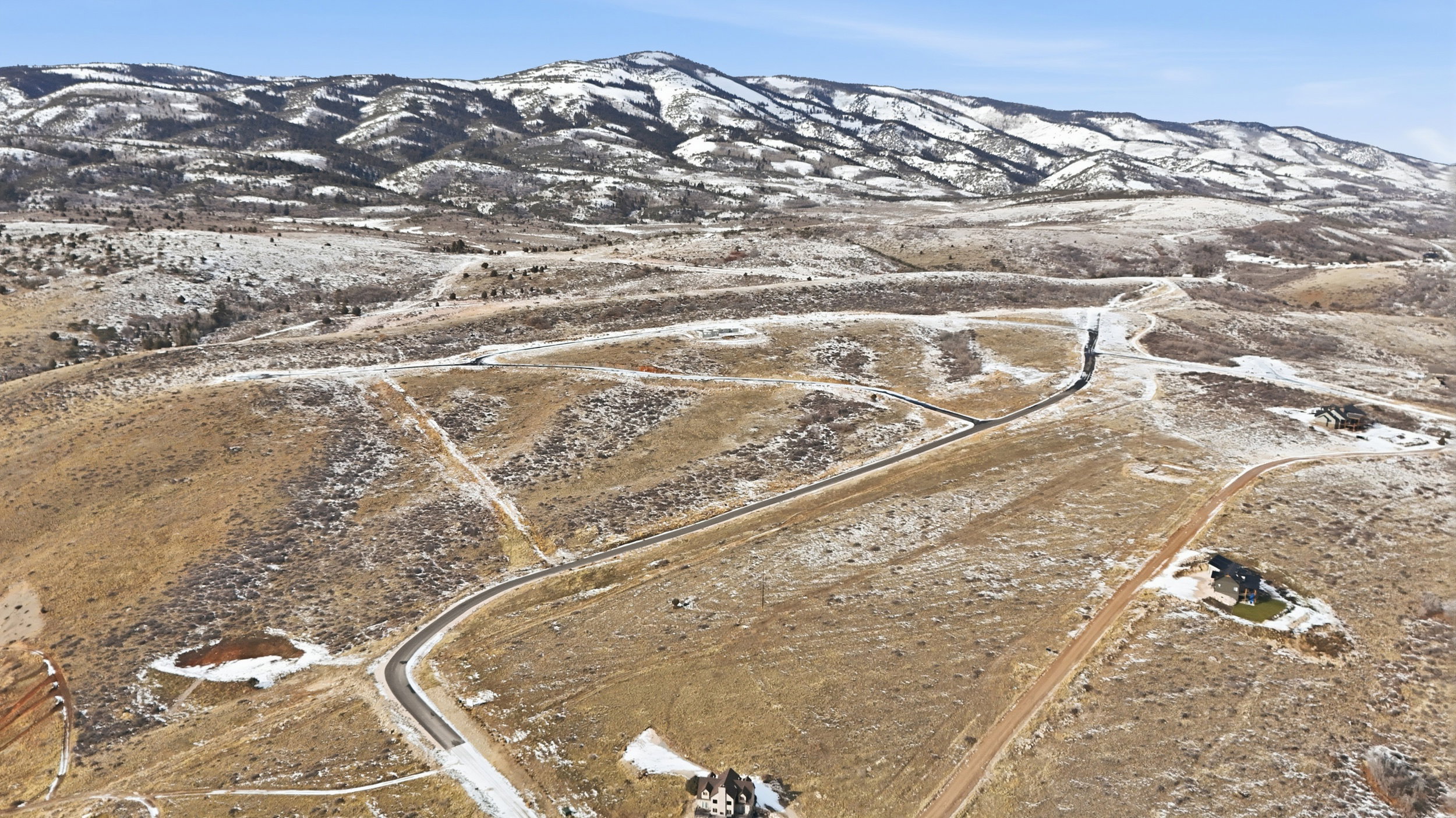 View of mountain backdrop with rural landscape