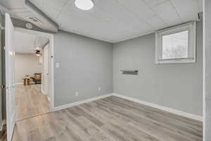 Empty room featuring light wood-style floors and baseboards