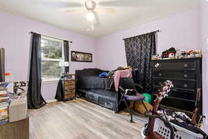 Bedroom featuring light wood-style flooring and ceiling fan