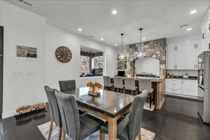 Dining area featuring recessed lighting