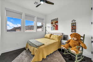 Bedroom featuring baseboards and ceiling fan