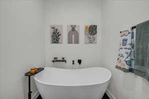 Full bath featuring a freestanding tub