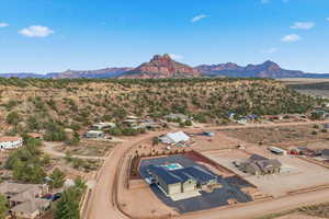 Aerial view of residential area featuring a mountain backdrop
