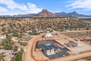 Aerial view of residential area with a mountainous background and a desert landscape