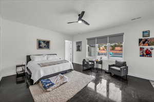 Bedroom featuring baseboards and ceiling fan