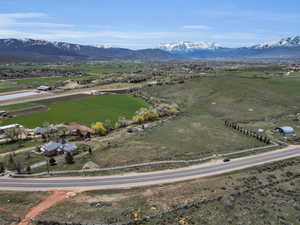 Aerial view of sparsely populated area featuring a mountainous background