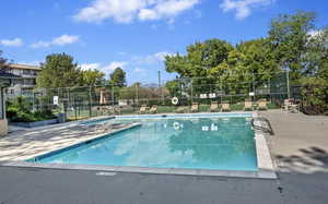 Community pool featuring a patio area