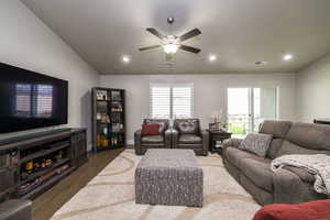 Living room featuring wood finished floors, a ceiling fan, and recessed lighting