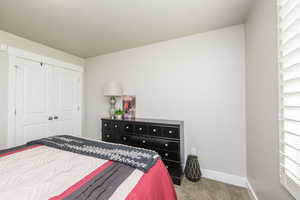 Bedroom with carpet flooring and a closet