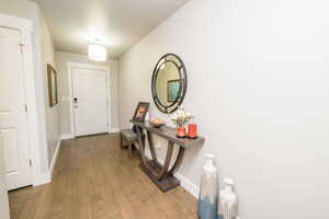 Doorway to outside with baseboards and hardwood / wood-style flooring