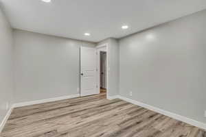 Spare room featuring recessed lighting and light wood-style floors