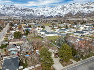 Aerial view of property's location featuring nearby suburban area and a mountain backdrop